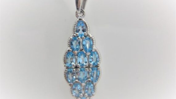 Rhodium plated 925 sterling silver pendant set with natural Swiss Blue topaz 38.75 X 12 MM