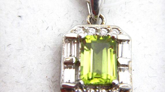 Rhodium plated 925 sterling silver pendant with natural Peridot & white topaz Approx size  12.2mm x 10mm Matching ring & earrings available
