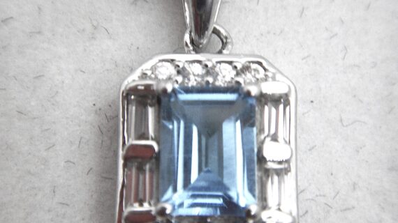 Rhodium plated 925 sterling silver pendant with natural Swiss blue topaz & white topaz Approx size  12.2mm x 10mm Matching ring & earrings available