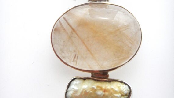 925 Sterling silver pendant set with Rutile quartz  freshwater pearl & smoky quartz Approx size 53mm x 24mm All markings are natural