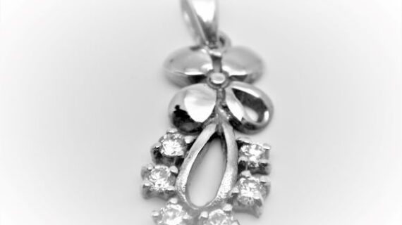 Rhodium plated 925 sterling silver pendant set with CZ   26.8 X 10.9 MM