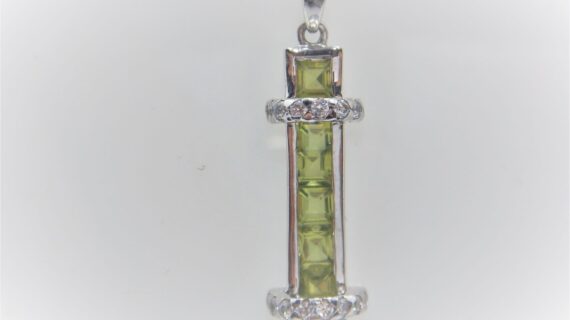 Rhodium plated 925 sterling silver pendant with natural Peridot & cubic zirconia Approx size  38mm x 10mm