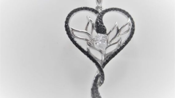 Rhodium plated 925 sterling silver pendant with Black & white cubic zirconia Approx size  43mm long