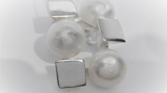 Rhodium plated 925 sterling silver pendant set with 3 Natural freshwater pearls Approx size  26mm x 20mm Matching earrings available