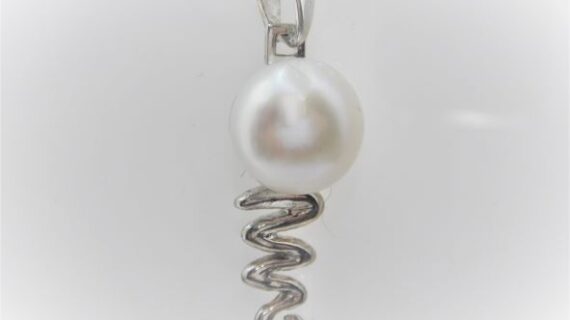Rhodium plated 925 sterling silver pendant set with natural freshwater pearl Approx size  33mm long Matching earrings available