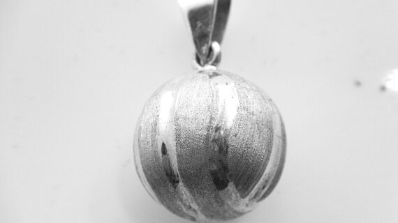 925 sterling silver harmony ball with tennis ball pattern & scratch finish  DIAM 19.5 MM