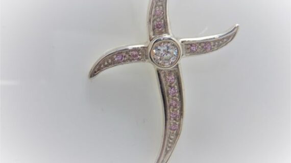 Rhodium plated 925 sterling silver cross pendant with Pink & white cubic zirconia Approx size  43mm x 32mm