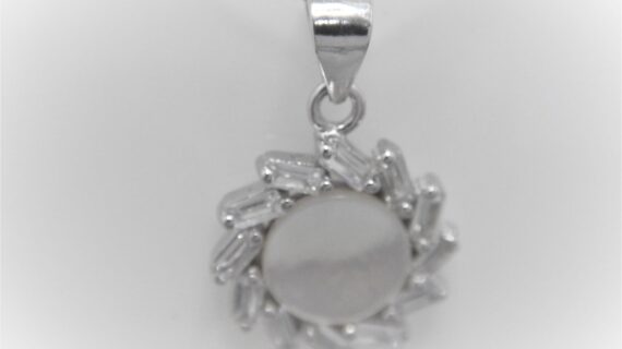Rhodium plated 925 sterling silver pendant set with natural Mother of pearl & cubic zirconia Approx size  14mm diam Matching earrings available