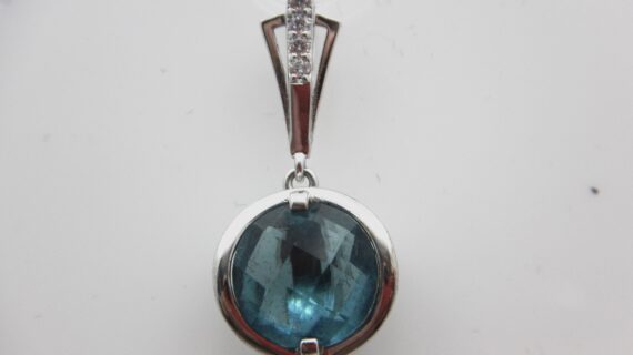 Rhodium plated 925 sterling silver pendant with dark aqua CZ   30 MM X 15 MM DIAM