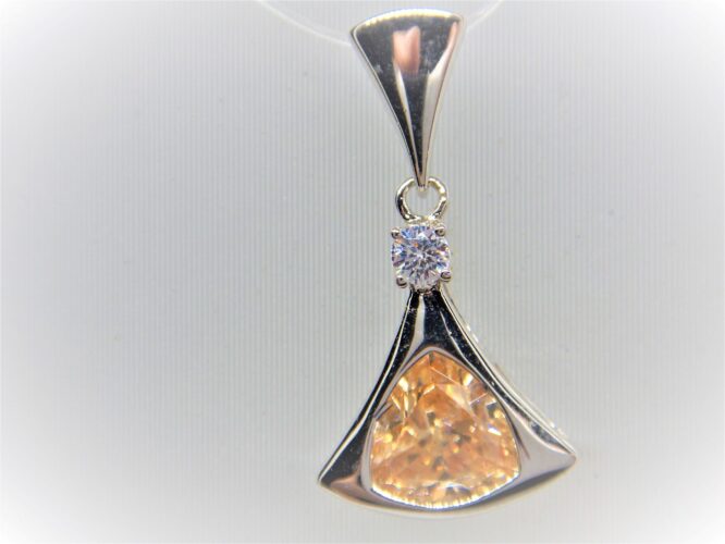 Rhodium plated 925 sterling silver pendant set with white & champagne CZ  25 X 14 MM