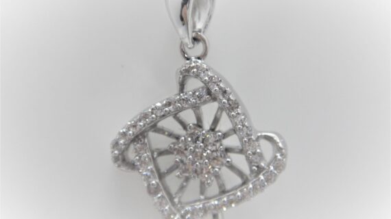 Rhodium plated 925 sterling silver pendant set with white cubic zirconia Approx size  16mm x 16mm Matching earrings available