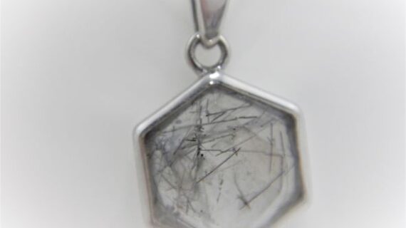 Rhodium plated 925 sterling silver hexagonal pendant with faceted natural Rutile quartz Approx size  14.5mm diam
