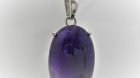 Rhodium plated 925 sterling silver hexagonal pendant with faceted natural Amethyst Approx size  14.5mm diam