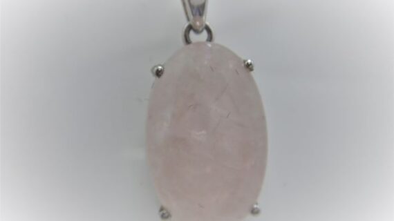 Rhodium plated 925 sterling silver oval pendant with natural Rose quartz Approx size  22mm x 14mm