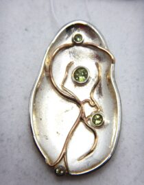 Rhodium plated 925 sterling silver pendant with gold plating set with natural Peridot 39.6 X  22.45MM