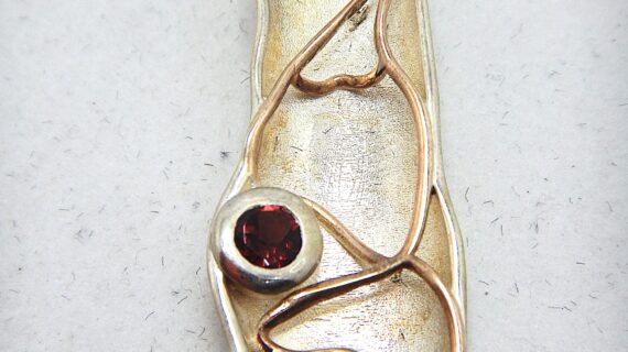 Rhodium plated 925 sterling silver pendant with natural Garnet & gold plating Approx size 48mm x 15.5mm