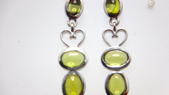 Rhodium plated 925 sterling silver earrings set with natural Peridot Approx size  31.00 Matching pendant available