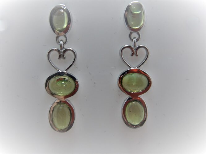 Rhodium plated 925 sterling silver earrings set with natural Peridot Approx size  31.00 Matching pendant available