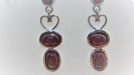 Rhodium plated 925 sterling silver earrings set with natural Garnet Approx size  31mm long Matching pendant available