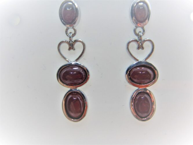 Rhodium plated 925 sterling silver earrings set with natural Garnet Approx size  31mm long Matching pendant available