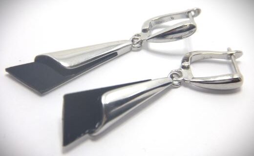 Rhodium plated 925 sterling silver earrings set with black onyx Approx size   30mm x 10mm