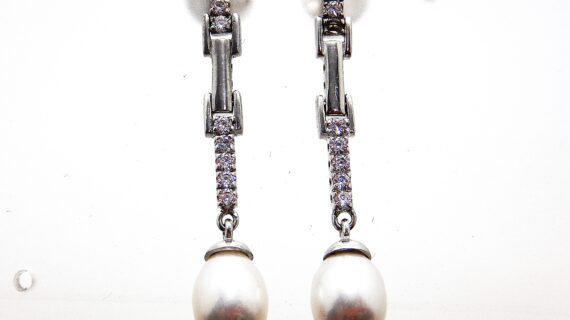 Rhodium plated 925 sterling silver stud earrings set with white cubic zirconia & natural freshwater pearl Approx size  43mm long