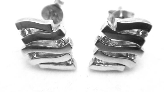 Rhodium plated 925 sterling silver earrings set with white cubic zirconia Approx sise  11mm x 9.5mm