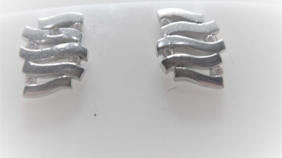 Rhodium plated 925 sterling silver earrings set with white cubic zirconia Approx sise  11mm x 9.5mm