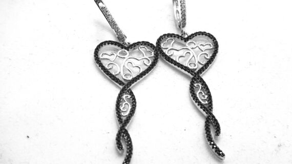 Rhodium plated 925 sterling silver earrings set with white & black cubic zirconia Approx size  65mm long