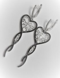 Rhodium plated 925 sterling silver earrings set with white & black cubic zirconia Approx size  65mm long