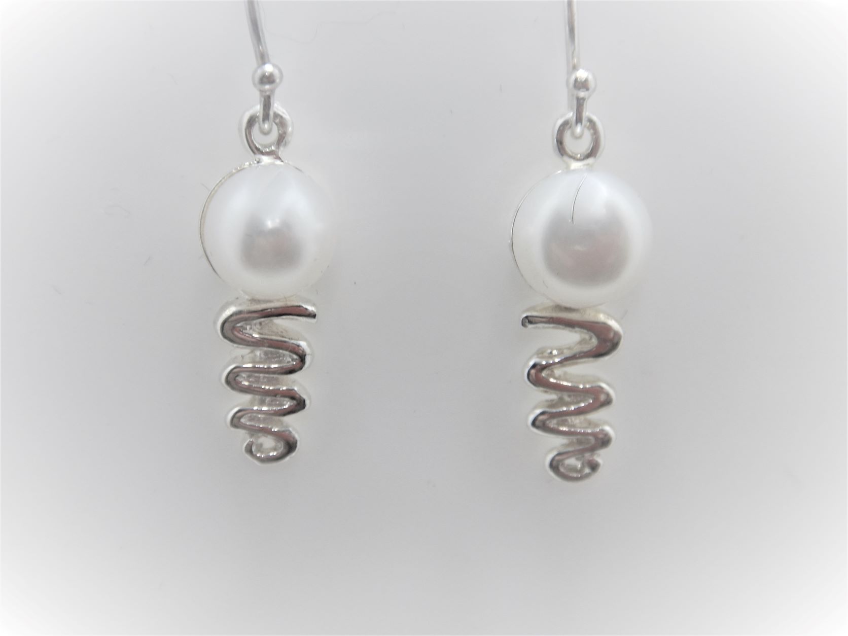 Rhodium plated 925 sterling silver earrings set with freshwater pearls  24.5 X 7.9 MM