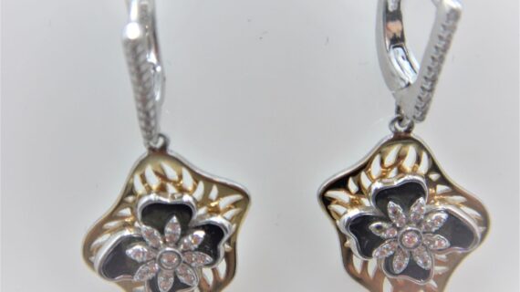 Rhodium & gold plated 925 sterling silver earrings set with white cubic zirconia & green enamel Approx size  39mm long Matching pendant available