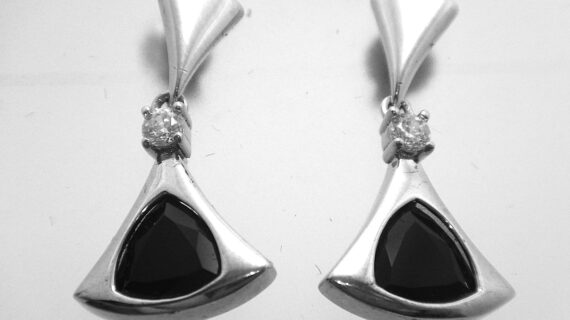 Rhodium plated 925 sterling silver triangular earrings set with white & black cubic zirconia Approx size 24mm long  Matching pendant available