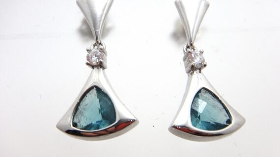 Rhodium plated 925 sterling silver triangular earrings set with white & blue cubic zirconia Approx size 24mm long Matching pendant available