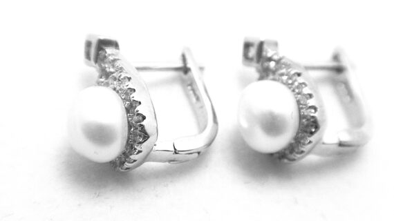 Rhodium plated925 sterling silver stud earrings set with cubic zirconia & natural freshwater pearls  Approx size  17.7mm x 7.5mm  Matching pendant & ring available