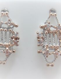 Rhodium & rose gold plated 925 sterling silver earrings set with white cubic zirconia Approx size  20mm x 12mm Matching pendant available