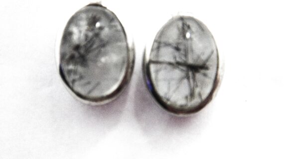 Rhodium plated 925 sterling silver oval studs set with natural Rutile quartz  11.6 X 8.8 MM