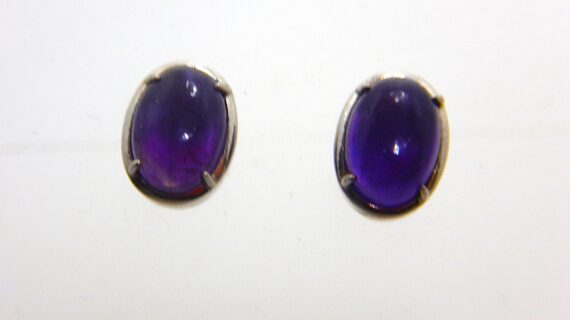 Rhodium plated 925 sterling silver oval studs set with natural Amethyst   11.6 X 8.65 MM