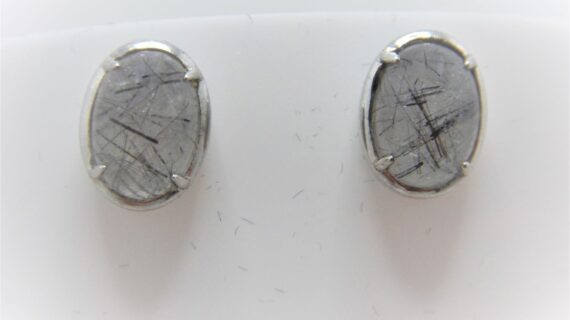 Rhodium plated 925 sterling silver oval studs set with natural Rutile quartz   11.6 X 8.65 MM