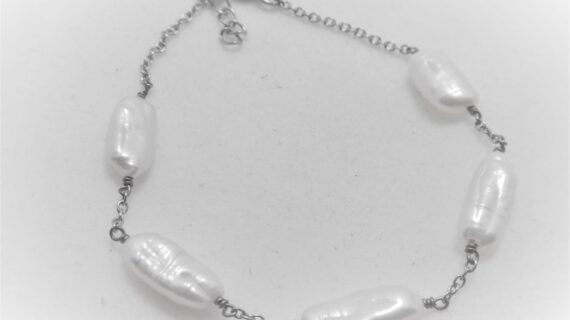 Rhodium plated 925 sterling silver bracelet set with 5 natural freshwater pearls Approx size  180mm long with 20mm extension