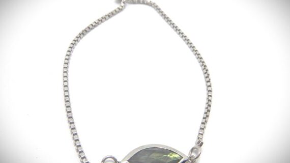 Rhodium plated 925 sterling silver adjustable bracelet set with natural faceted Labradorite Approx size of stone 20mm x 10mm        Bracelet 110mm