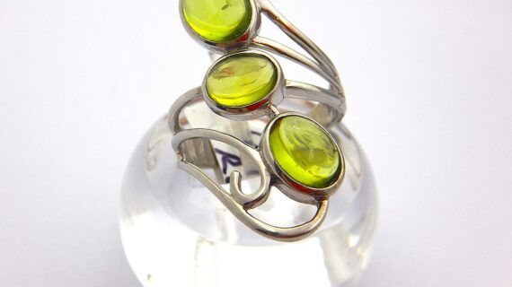 Rhodium plated 925 sterling silver ring set with natural Peridot 35MM LONG