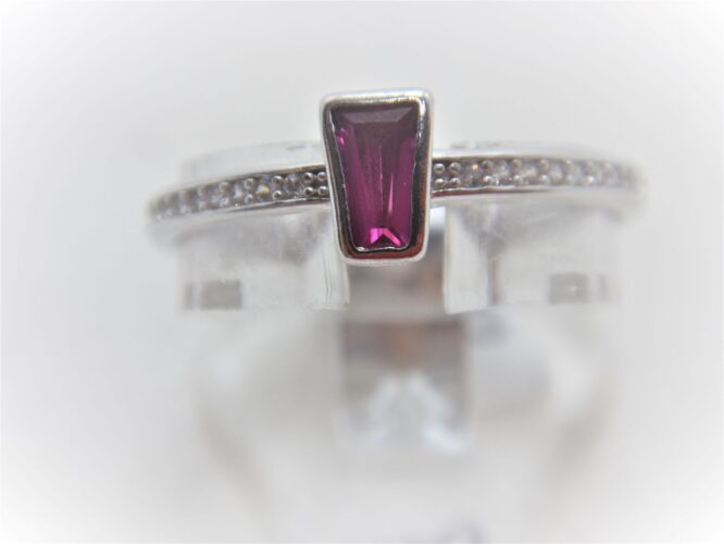 Rhodium plated 925 sterling silver ring set with small CZ & a Synthetic garnet 5.6 X 3.7