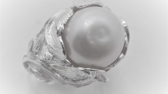 Rhodium plated 925 sterling silver set with natural freshwater pearl Approx size  17mm diam
