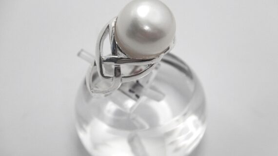 Rhodium plated 925 sterling silver ring set with natural freshwater pearl Approx size  11.8mm diam