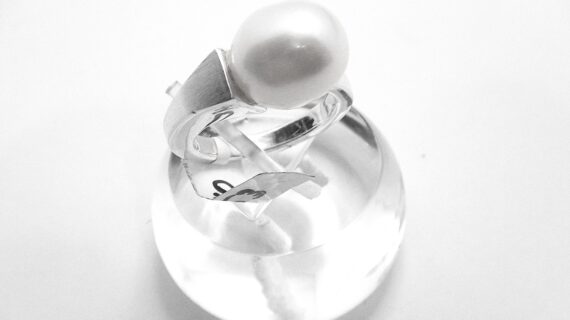 Rhodium plated 925 sterling silver ring set with natural freshwater pearl Approx size  11.5mm diam