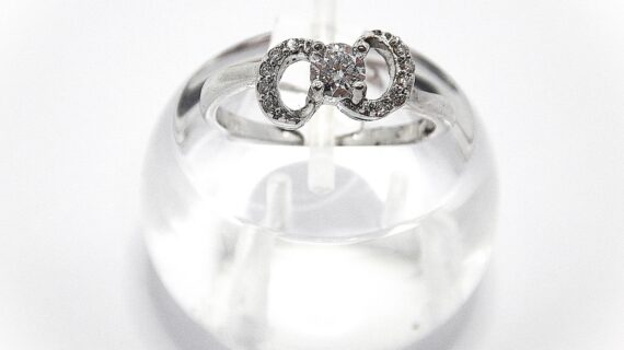 Rhodium plated 925 sterling silver ring set with CZ  7.15 WIDE