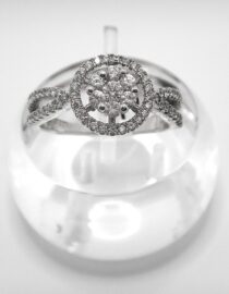 Rhodium plated 925 sterling silver ring set with white CUBIC ZIRCONIA  Approx size  11mm diam