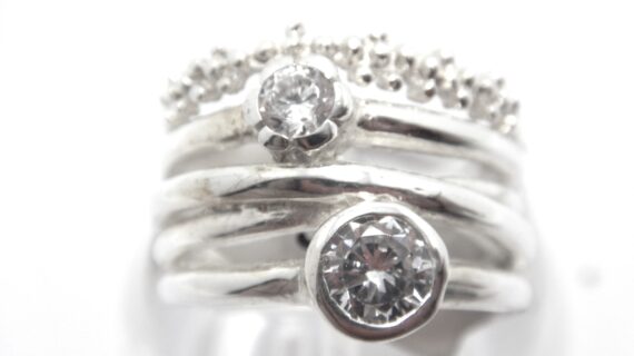 Rhodium plated 925 sterling silver ring set with 2 CZ  18 MM WIDE