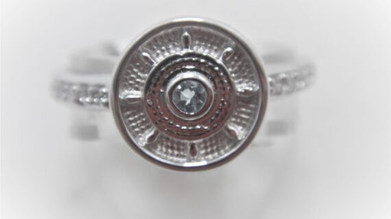 Rhodium plated 925 sterling silver ring set with natural Blue Topaz DIAM 10.3MM